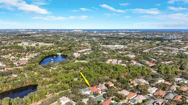 an aerial view of residential houses with city view