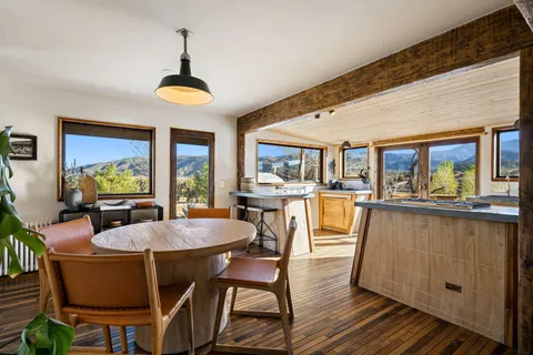 a kitchen with stainless steel appliances granite countertop a stove and a refrigerator