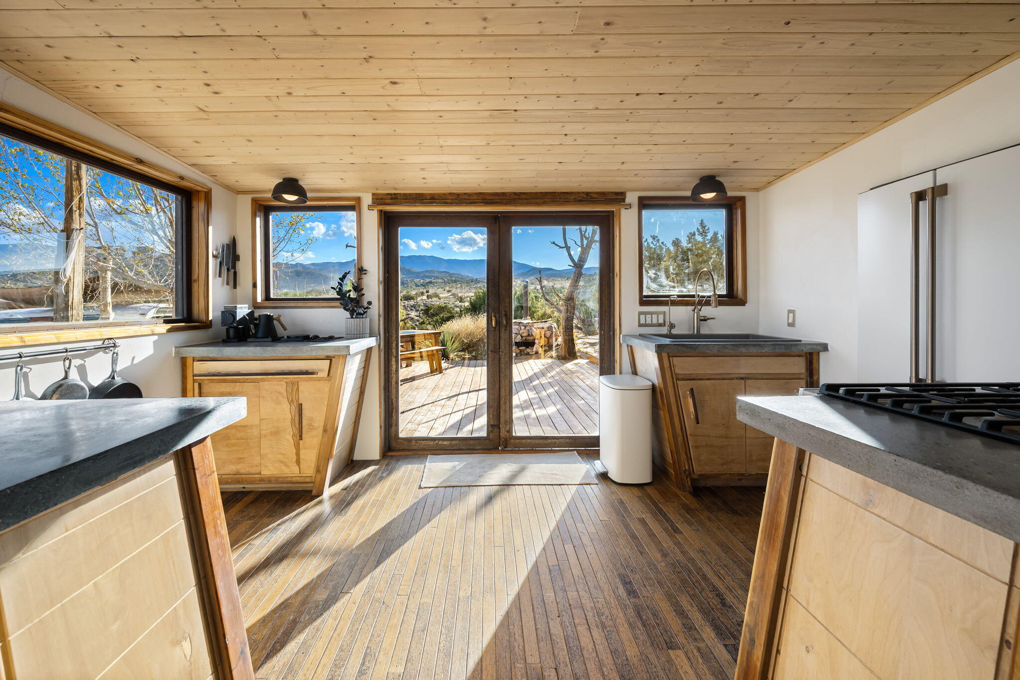 1102 Burlington Road Landers, CA 92285 - Photo 19 of 68 a kitchen with a stove a sink a microwave and cabinets