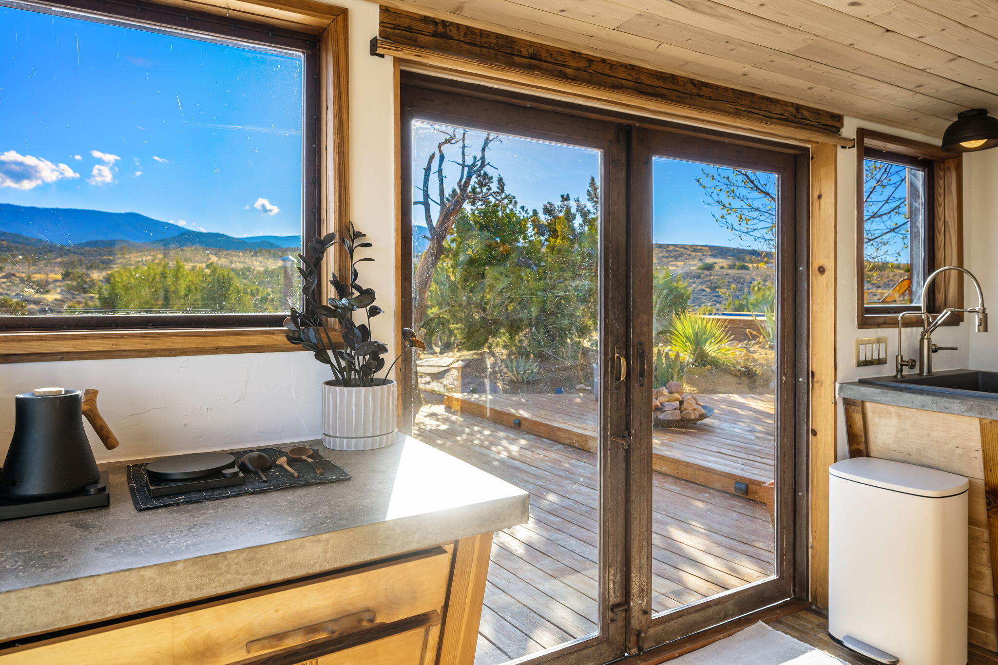 1102 Burlington Road Landers, CA 92285 - Photo 26 of 68 a room with wooden floor and outdoor view