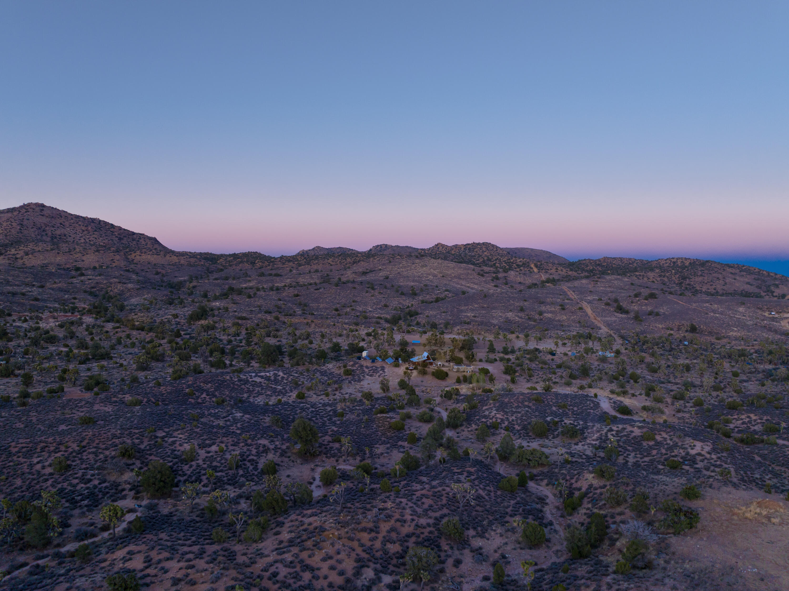 1102 Burlington Road Landers, CA 92285 - Photo 68 of 68 a view of a dry yard with mountains in the background