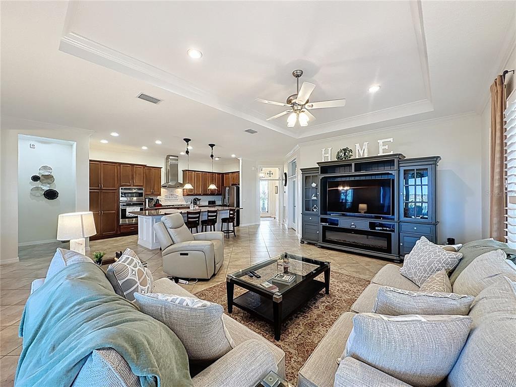 168 Silver Maple Road Groveland, FL 34736 - Photo 12 of 71 a living room with furniture and a flat screen tv