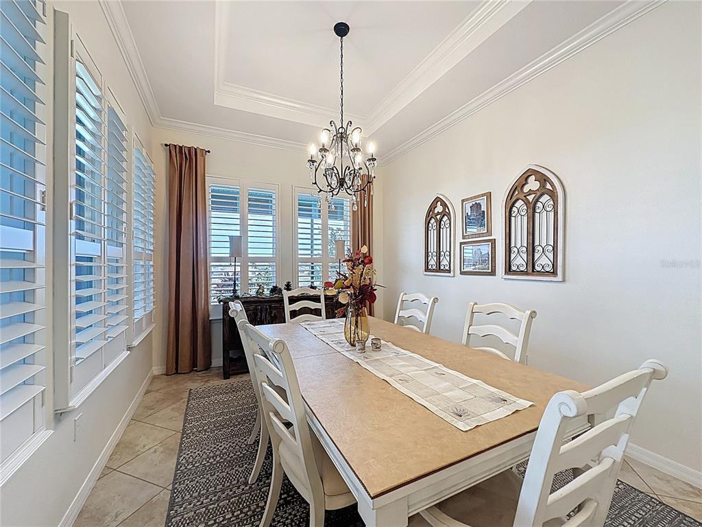168 Silver Maple Road Groveland, FL 34736 - Photo 23 of 71 a view of a dining room with furniture and window
