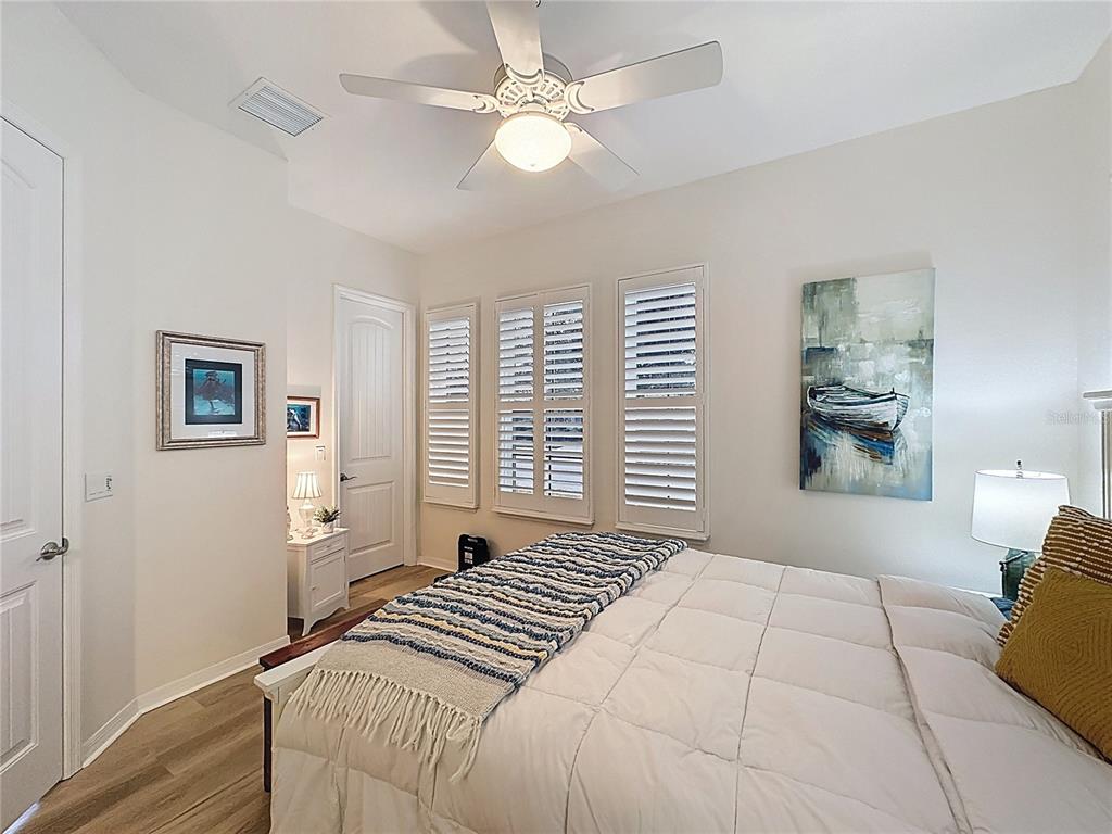 168 Silver Maple Road Groveland, FL 34736 - Photo 27 of 71 a bedroom with a large bed and a window