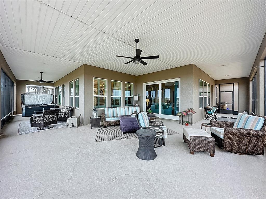 168 Silver Maple Road Groveland, FL 34736 - Photo 47 of 71 a living room with furniture and a large window