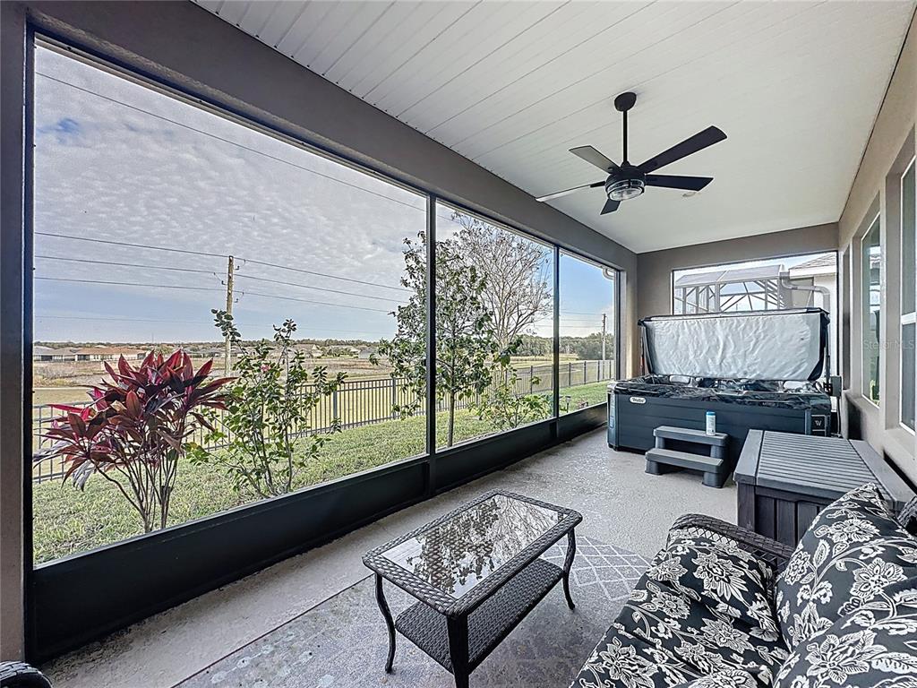 168 Silver Maple Road Groveland, FL 34736 - Photo 50 of 71 a living room with furniture and a large window