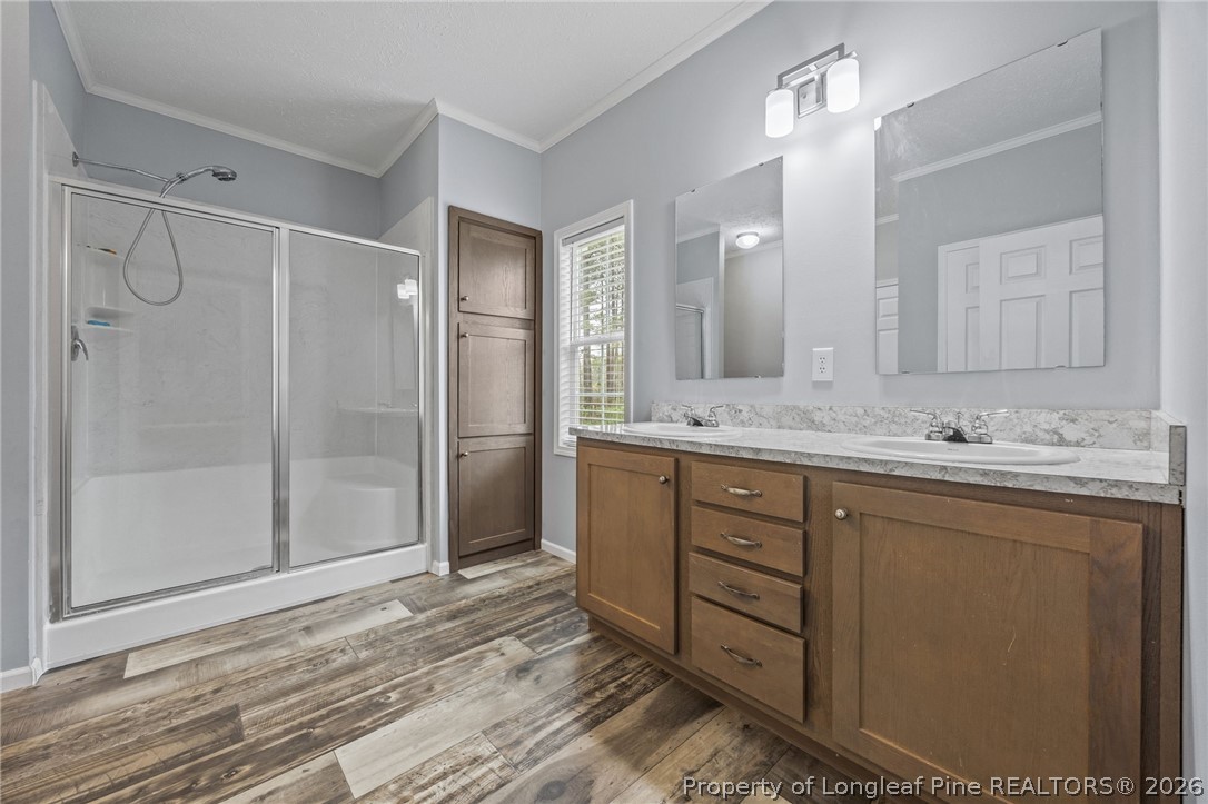 2252 Old Stage Road South Erwin, NC 28339 - Photo 28 of 47 a bathroom with a granite countertop sink mirror and shower