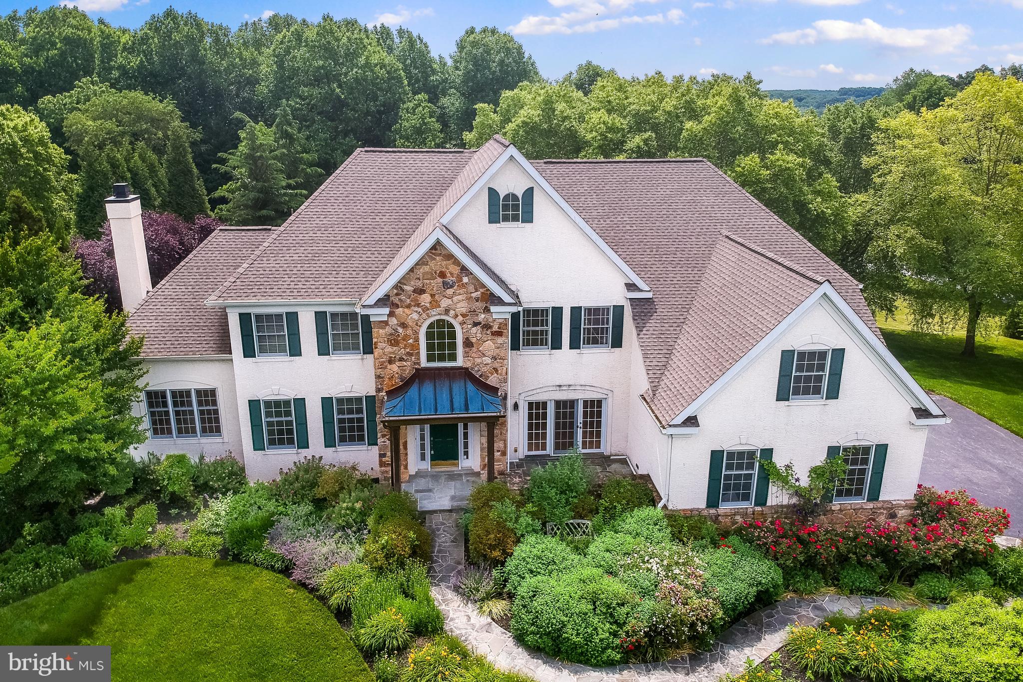 a aerial view of a house with a yard