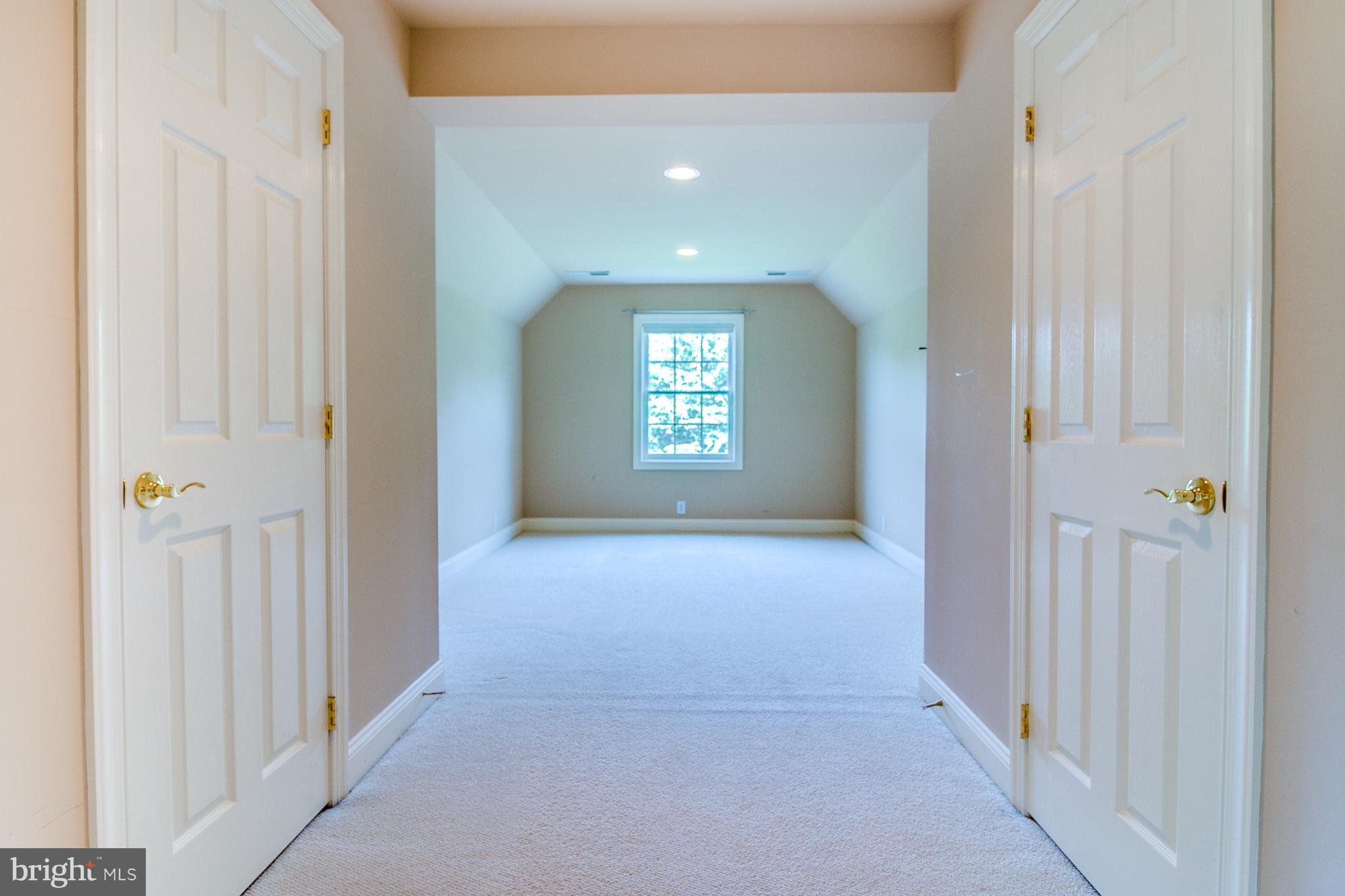 206 Fern Ridge Landenberg, PA 19350 - Photo 17 of 34 a view of a hallway with windows and brick walls