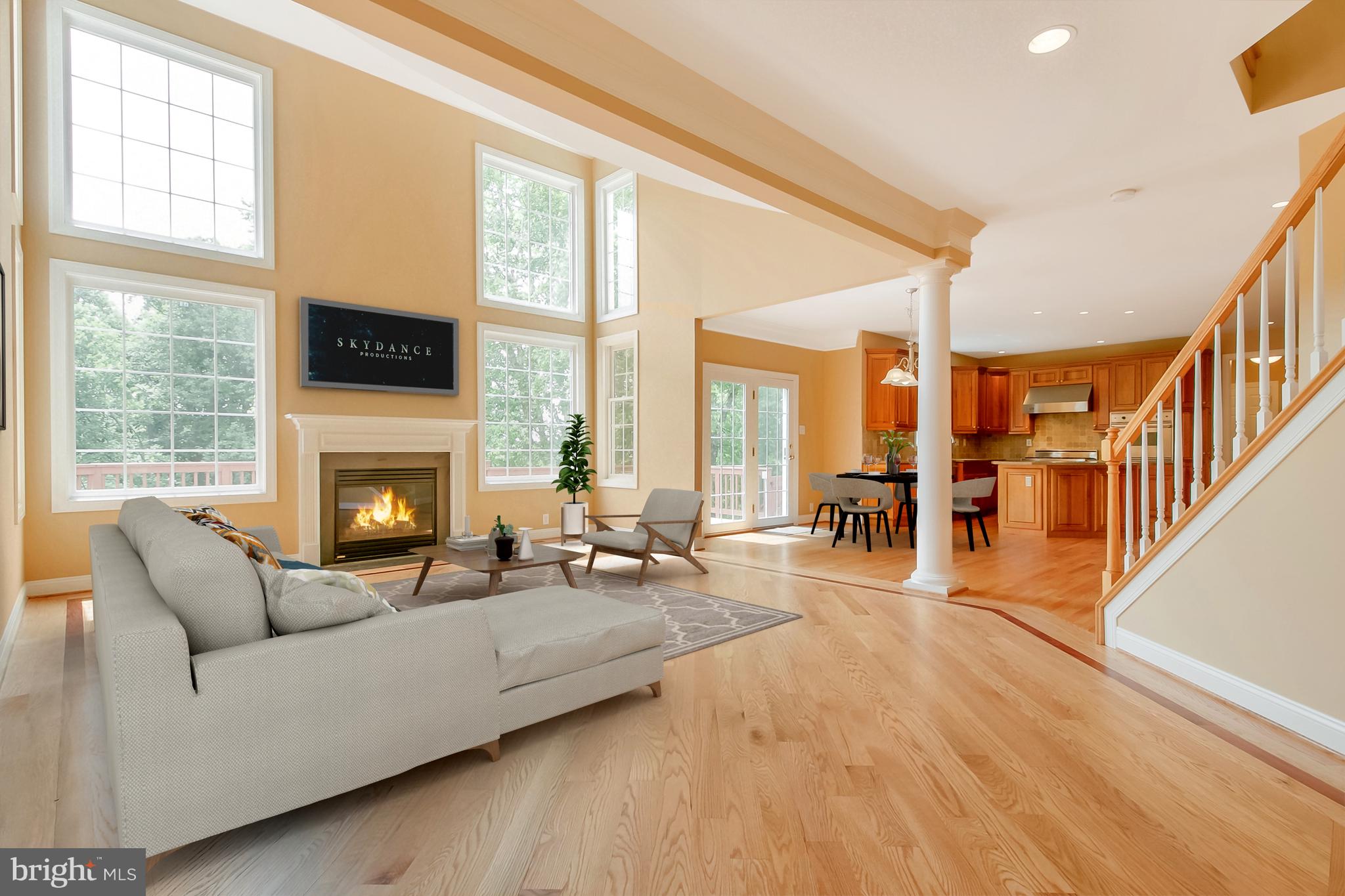 206 Fern Ridge Landenberg, PA 19350 - Photo 4 of 34 a living room with furniture a fireplace and a floor to ceiling window