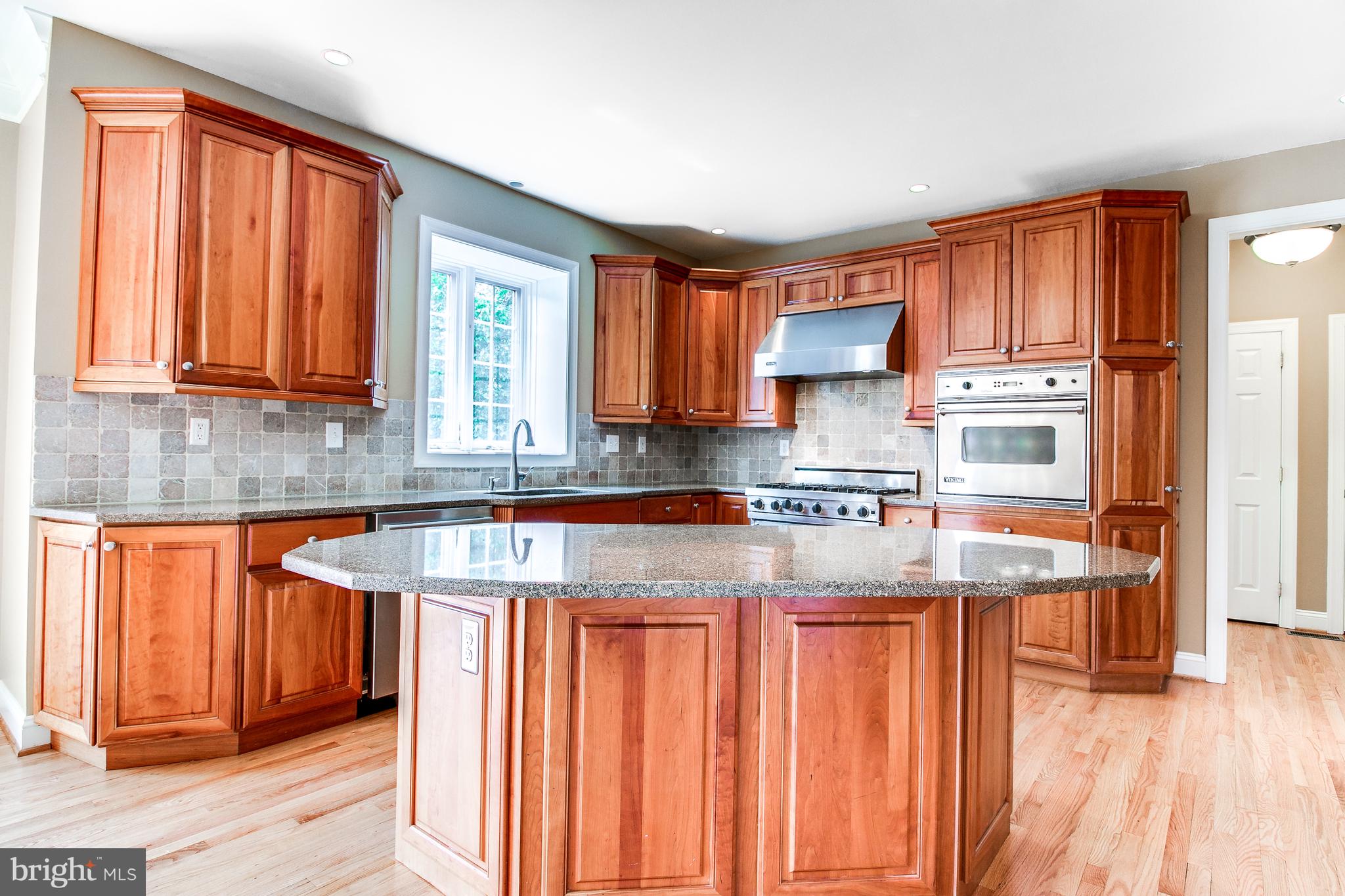 206 Fern Ridge Landenberg, PA 19350 - Photo 7 of 34 a kitchen with stainless steel appliances granite countertop a stove a sink and a microwave