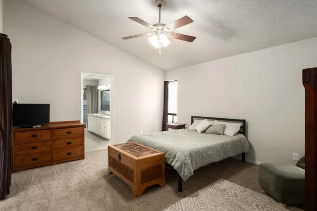 a bedroom with a bed and dresser