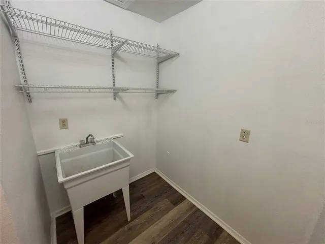 a yellow building in the middle of a yard