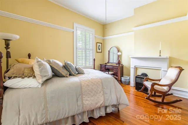 a bedroom with a bed and a chair