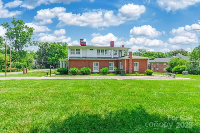 a view of a big building with a big yard
