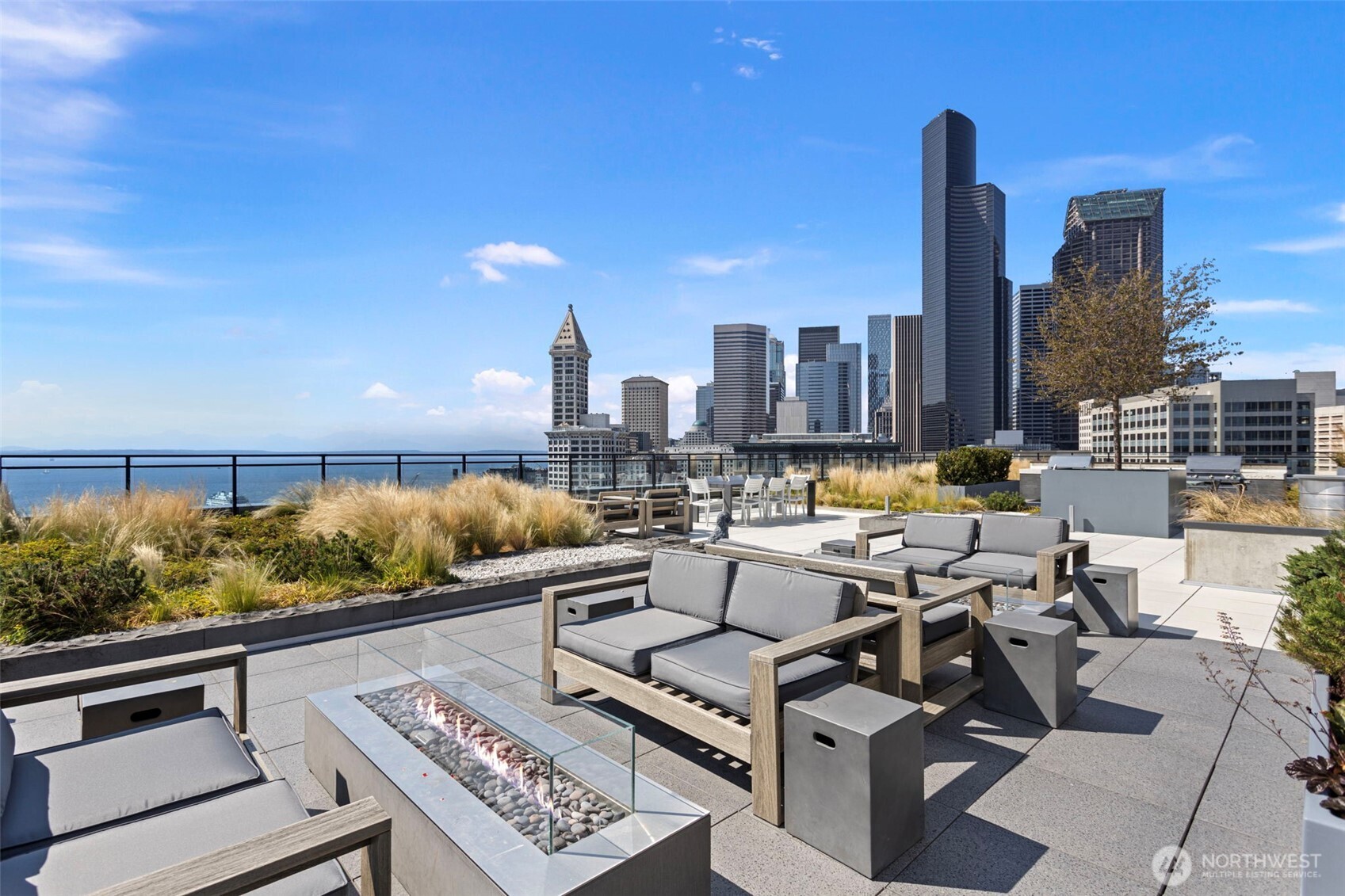 450 South Main Street, Unit 1005 Seattle, WA 98104 - Photo 22 of 33 a view of roof deck with seating space and trees