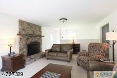 6 Pleasant View Road Lebanon, NJ 08833 - Photo 7 of 24 a living room with furniture and a fireplace