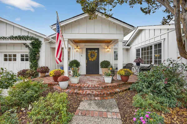 a front view of house with outdoor seating