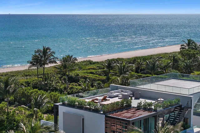 a living room with stainless steel appliances kitchen island granite countertop furniture and a kitchen view
