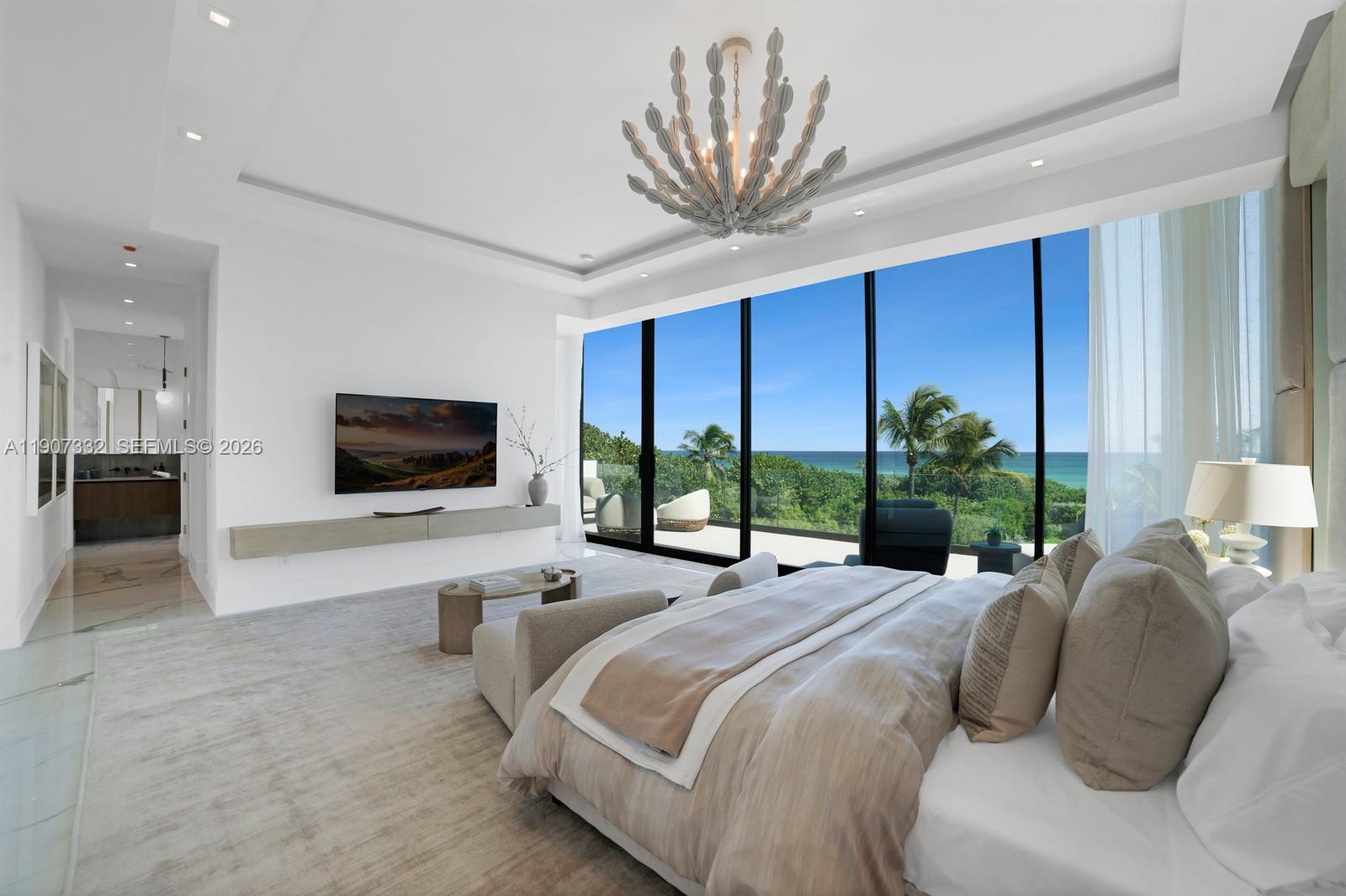 7845 Atlantic Way Miami Beach, FL 33141 - Photo 20 of 89 a bedroom with a bed a large window and flat screen television