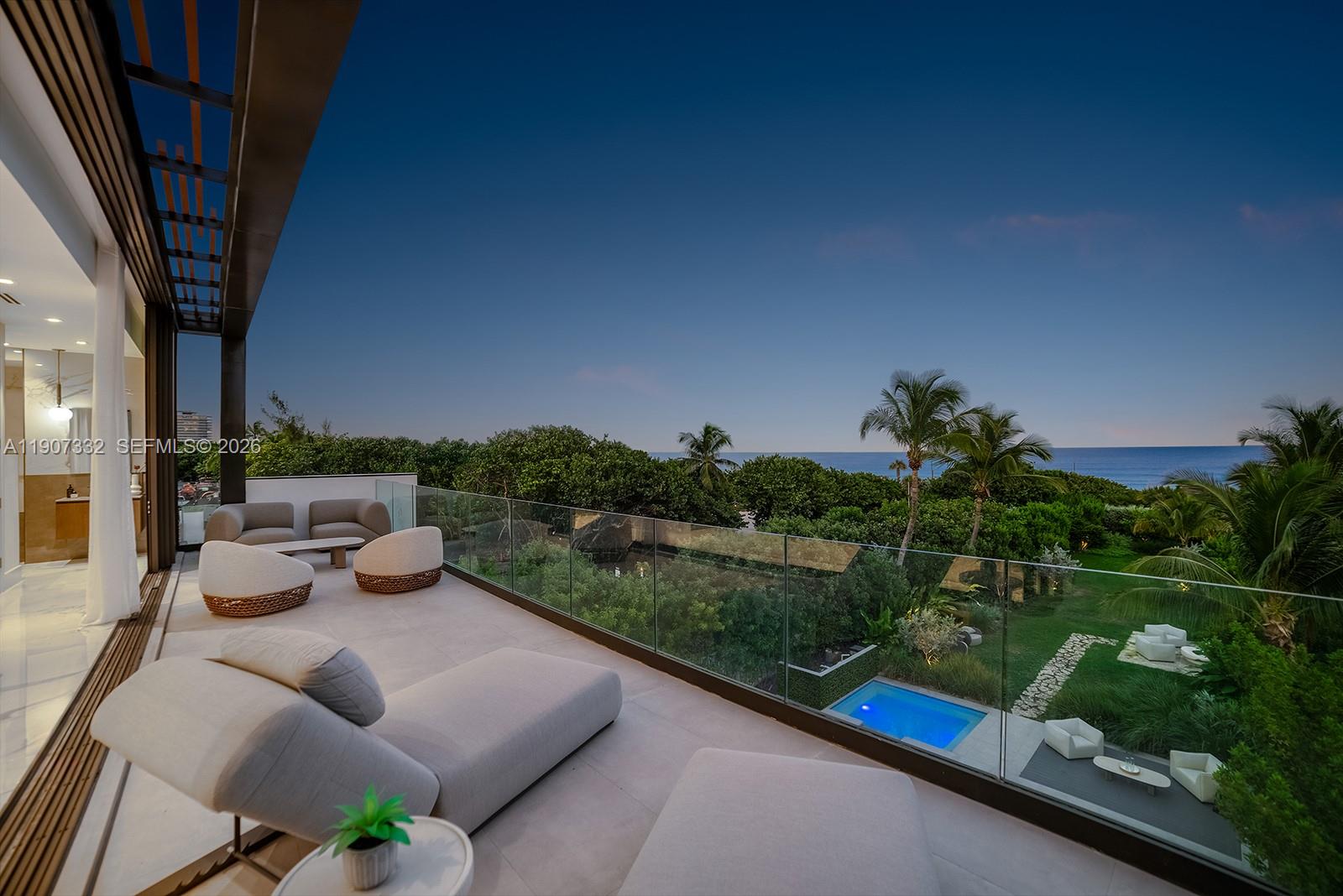 7845 Atlantic Way Miami Beach, FL 33141 - Photo 32 of 89 a view of a patio with couches table and chairs and potted plants
