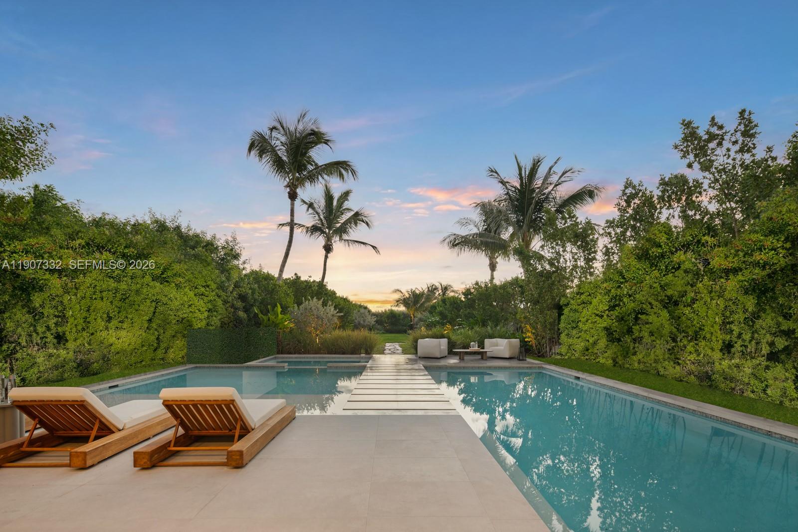 7845 Atlantic Way Miami Beach, FL 33141 - Photo 69 of 89 a view of a chair and table on the balcony