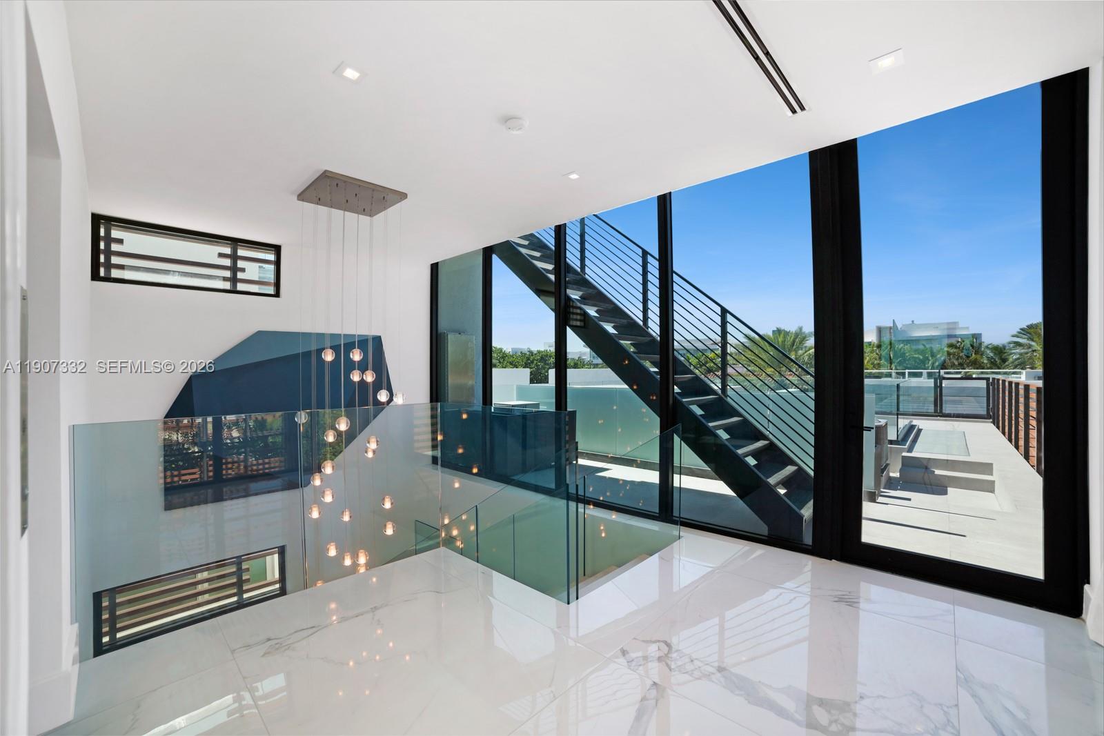 7845 Atlantic Way Miami Beach, FL 33141 - Photo 75 of 89 a view of staircase with a rug