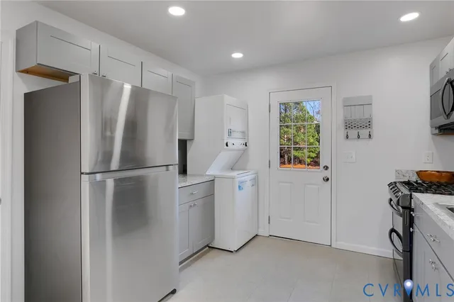 a white refrigerator freezer sitting in a kitchen