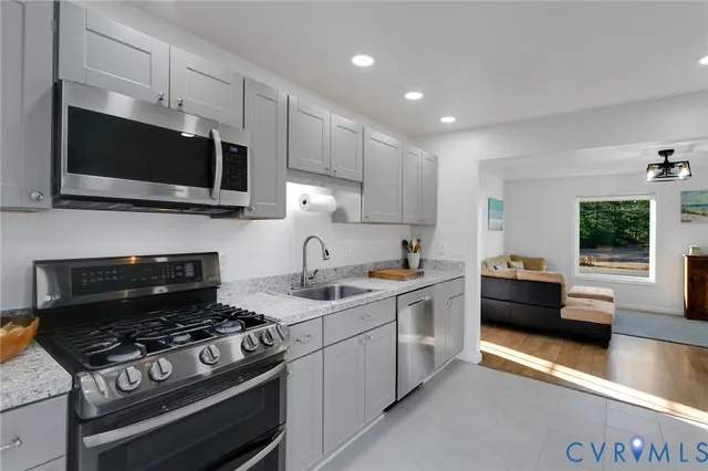 a kitchen with a stove and a microwave