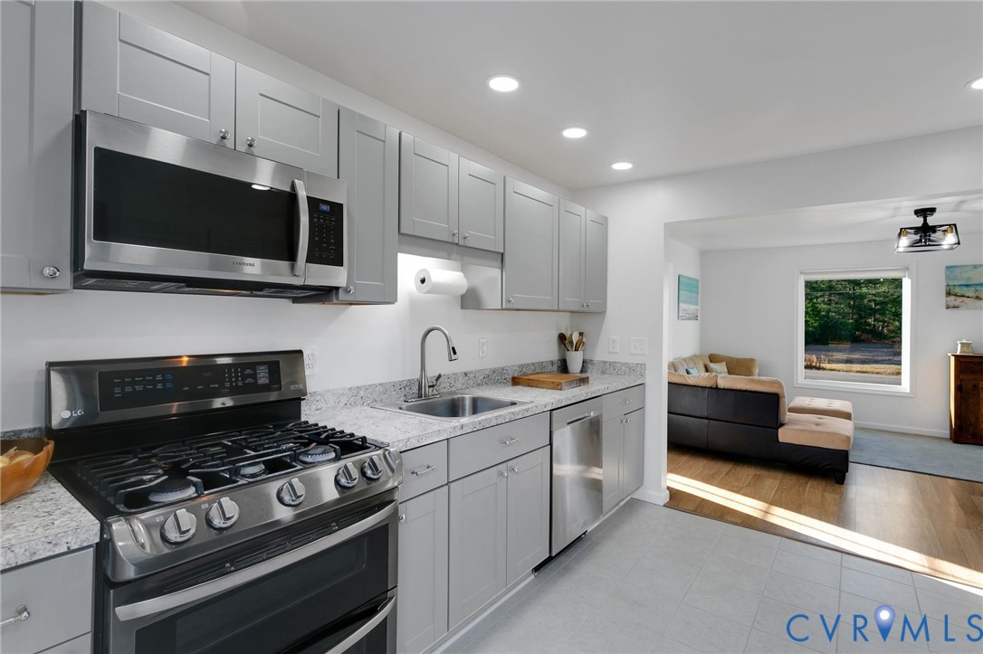 4462 Windmill Point Road White Stone, VA 22578 - Photo 12 of 29 a kitchen with a stove and a microwave