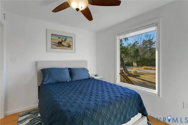 a bedroom with a large bed and a window