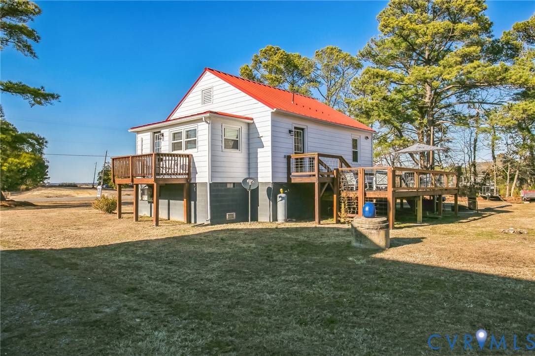 4462 Windmill Point Road White Stone, VA 22578 - Photo 24 of 29 a front view of a house with a yard