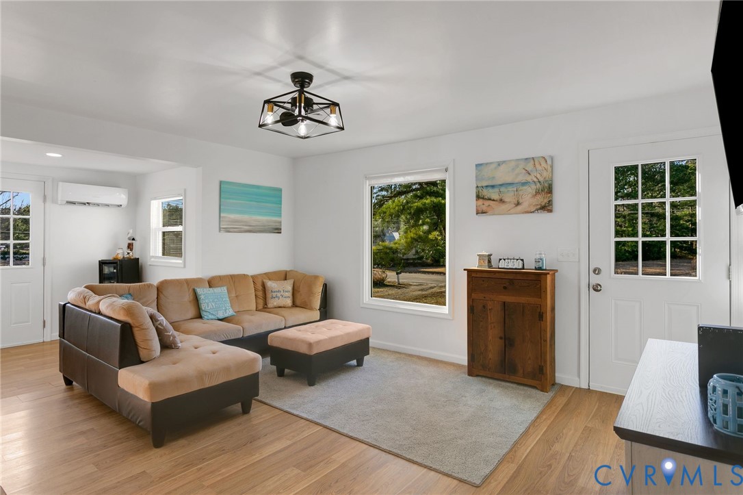 4462 Windmill Point Road White Stone, VA 22578 - Photo 4 of 29 a living room with furniture and a window