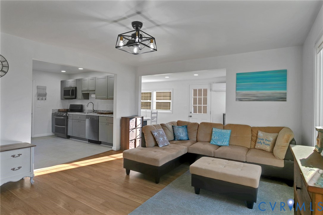 4462 Windmill Point Road White Stone, VA 22578 - Photo 8 of 29 a living room with furniture and kitchen view