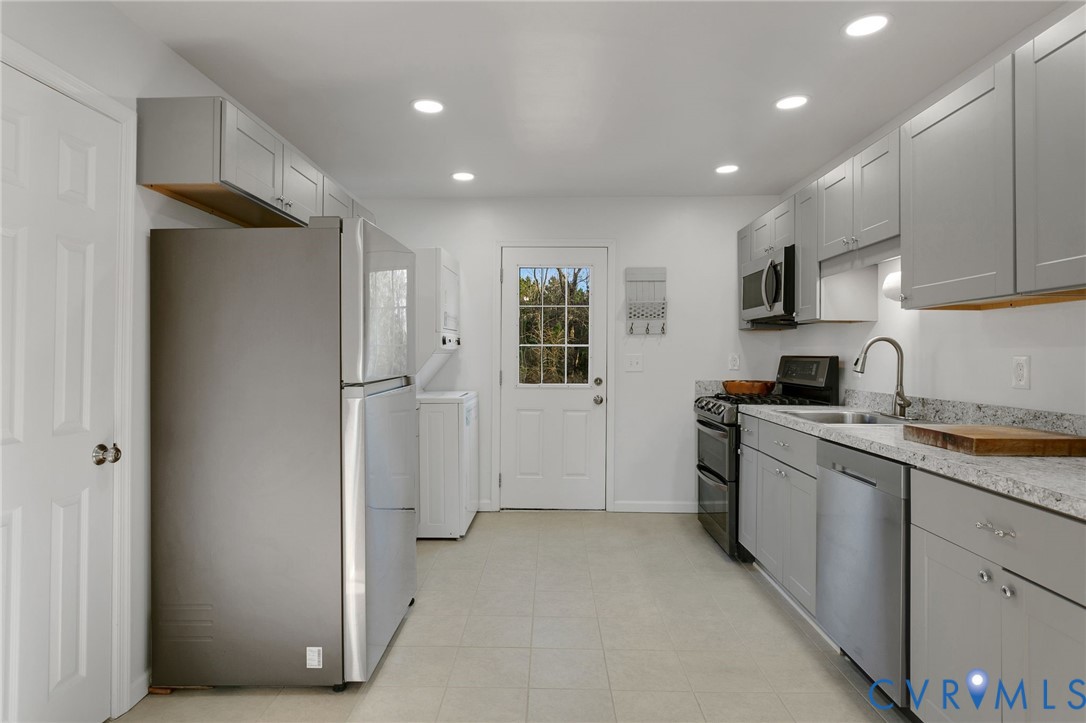 4462 Windmill Point Road White Stone, VA 22578 - Photo 10 of 29 a kitchen with cabinets and a stove top oven