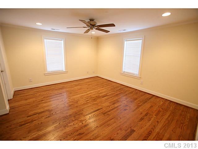 6441 Stirewalt Road Kannapolis, NC 28081 - Photo 9 of 16 a view of an empty room with wooden floor and a window