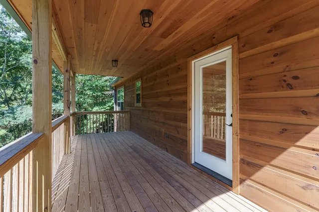 a view of a balcony with wooden floor