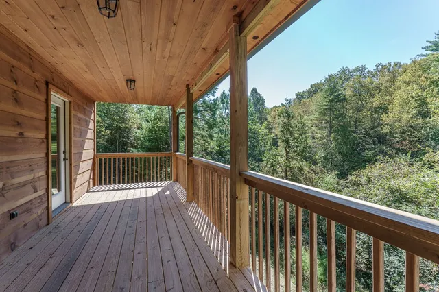 a view of balcony with wooden floor