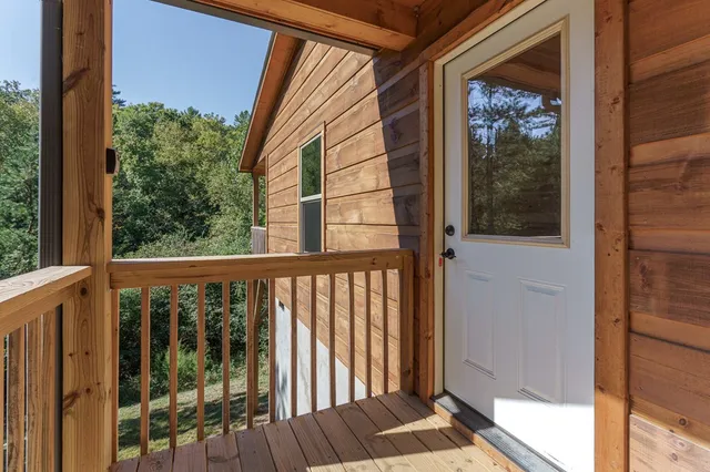 a view of a glass door with a balcony