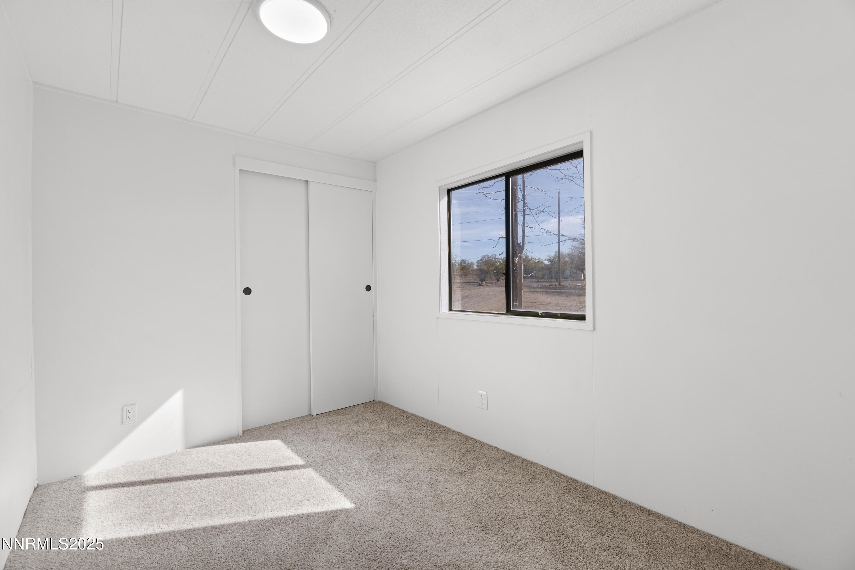 4915 Cheyenne Trail Stagecoach, NV 89429 - Photo 17 of 26 a view of an empty room with windows