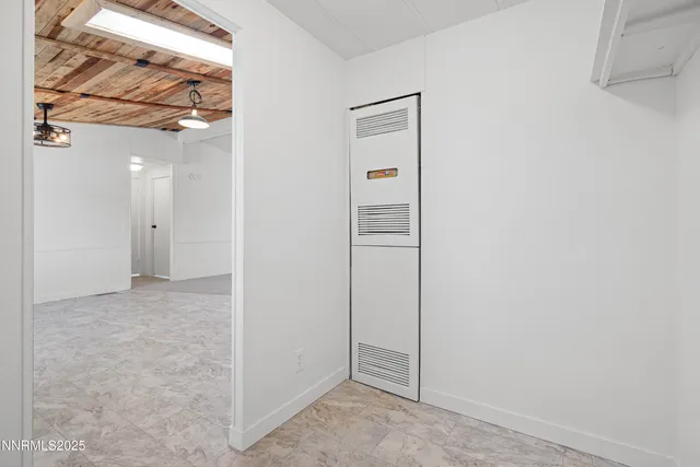 a view of balcony with wooden floor and fence