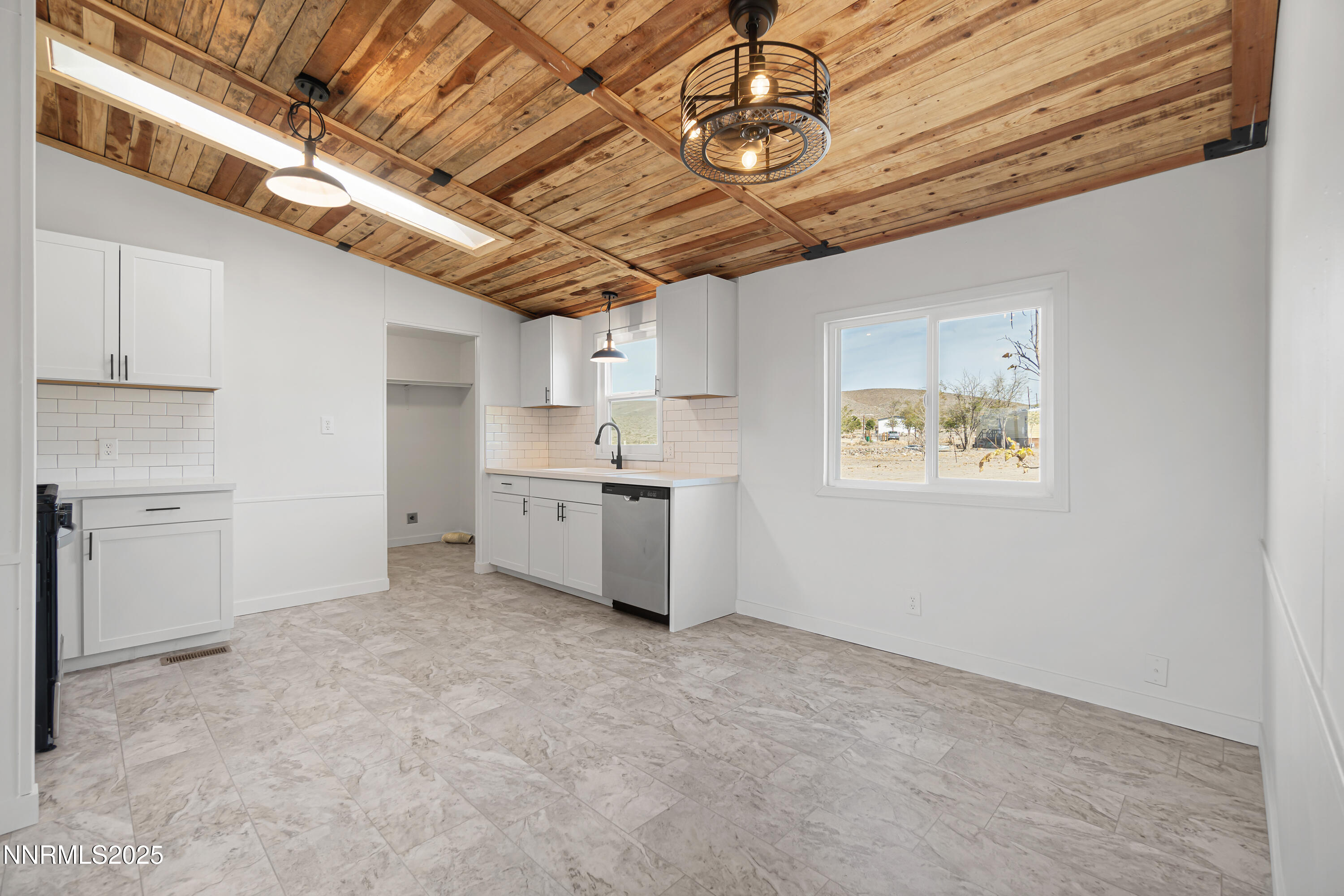 4915 Cheyenne Trail Stagecoach, NV 89429 - Photo 8 of 26 a view of a storage & utility room with wooden shelves