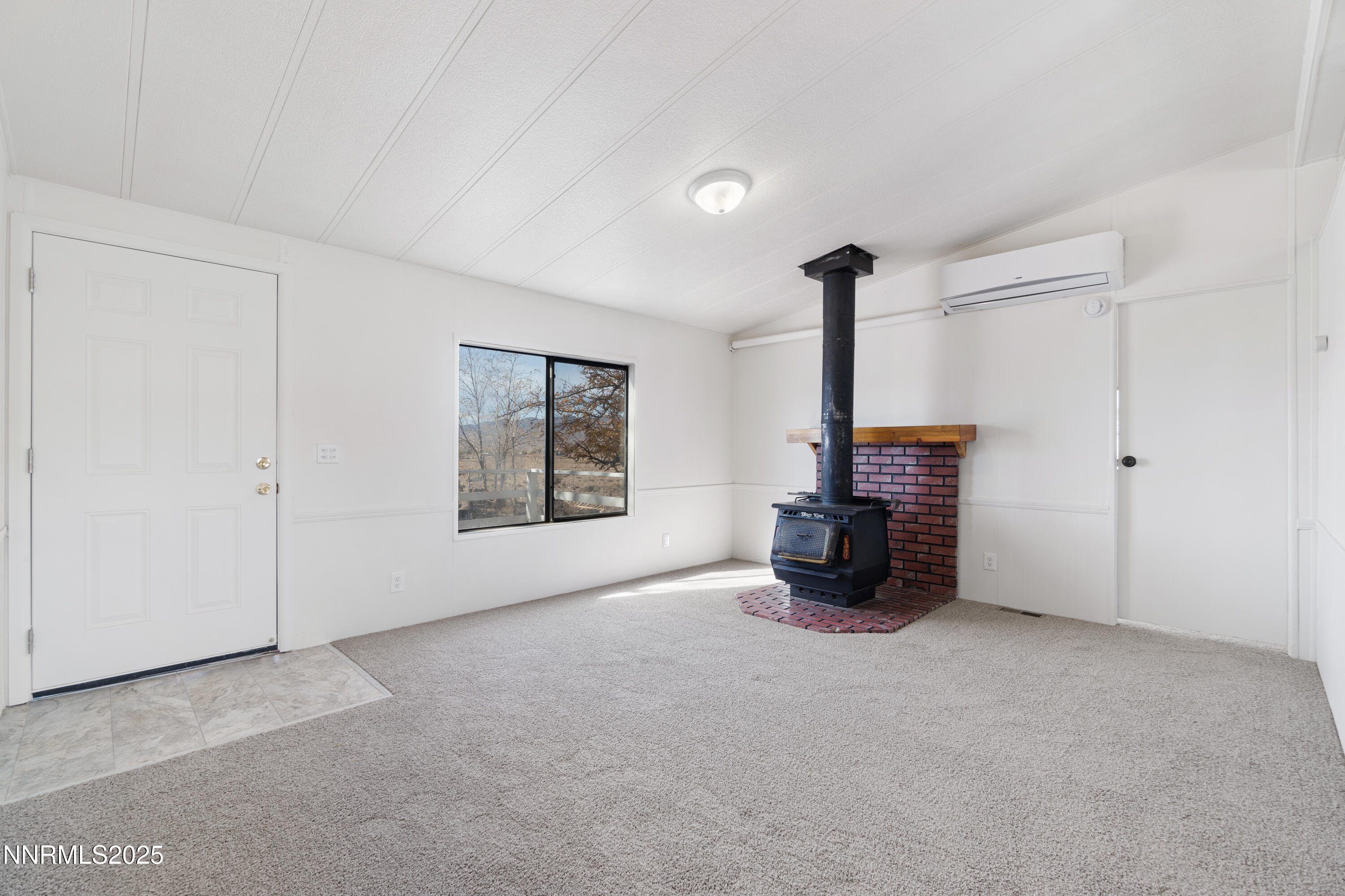 4915 Cheyenne Trail Stagecoach, NV 89429 - Photo 9 of 26 a view of empty room with a fireplace