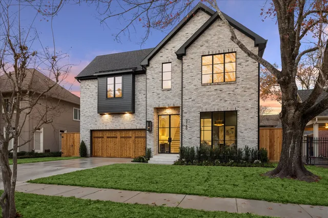 a view of a dining room with furniture a chandelier and wooden floor