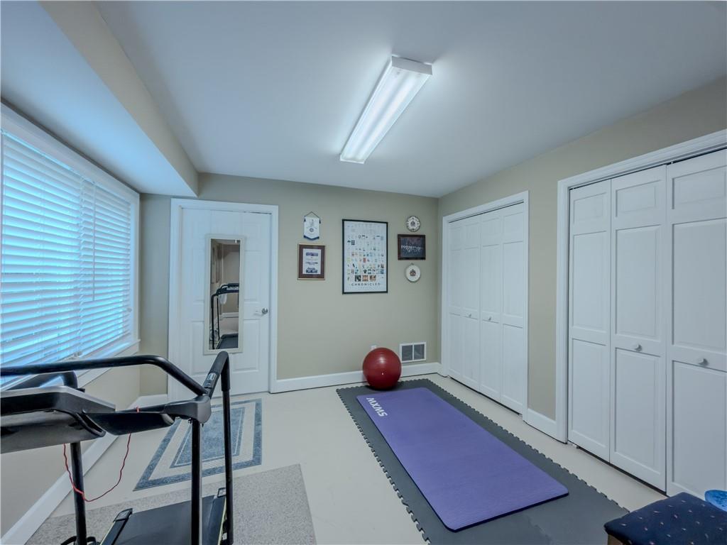 4284 Cedar Bluff Way Southwest Lilburn, GA 30047 - Photo 54 of 62 a bedroom with furniture and a window