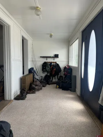 a bed room with furniture and a mirror