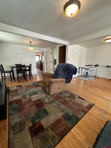 a bedroom with double bed and a large window