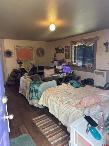 a bedroom with bed and a window