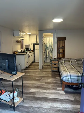 a view of a living room and kitchen