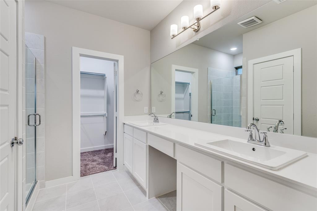 2544 Rambling Road Celina, TX 75009 - Photo 21 of 25 Bathroom with a shower with shower door, tile floors, vanity with extensive cabinet space, and dual sinks